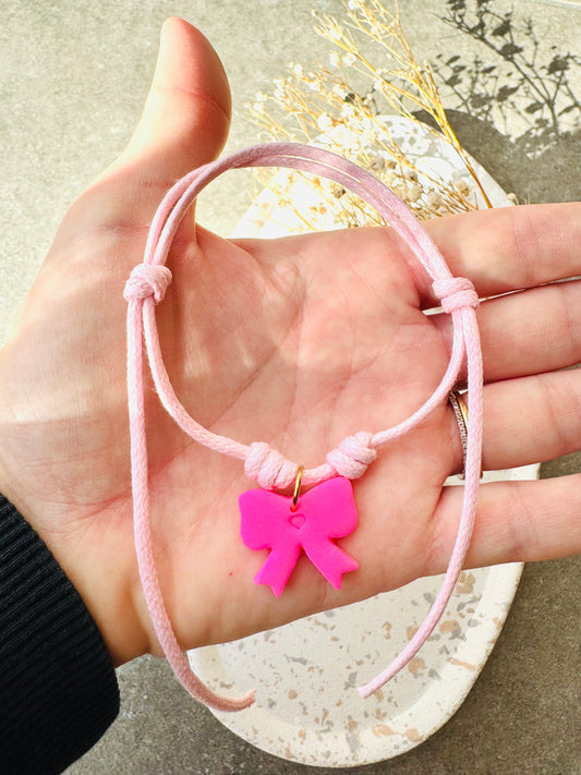 Bracelet ajustable noeud fushia